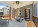 Comfortable screened-in porch with seating area and an entrance to a home at 516 Culmore Dr, Fuquay Varina, NC 27526
