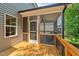 Exterior view of the screened-in porch of this home, with access door and window at 516 Culmore Dr, Fuquay Varina, NC 27526