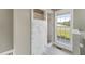 Modern bathroom with marble tile shower and window providing natural light at 5405 Overdale Ln, Raleigh, NC 27603