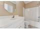 Cozy bathroom with a single sink, light tile flooring, and a bathtub at 5405 Overdale Ln, Raleigh, NC 27603