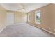 Spacious bedroom with neutral carpeting and large windows, filling the room with natural light at 5405 Overdale Ln, Raleigh, NC 27603