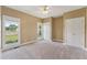 Cozy bedroom with neutral carpeting, double closets, and bright windows at 5405 Overdale Ln, Raleigh, NC 27603