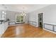 Inviting dining room featuring hardwood floors, a modern chandelier, and neutral color scheme at 5405 Overdale Ln, Raleigh, NC 27603