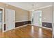 Welcoming entryway with hardwood floors, white trim, neutral wall paint, and natural light at 5405 Overdale Ln, Raleigh, NC 27603