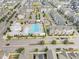 Aerial view of community pool, clubhouse, playground, and neighborhood homes at 5908 Giddings St, Raleigh, NC 27616