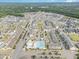 Aerial view of neighborhood with community pool, playground, parks, and townhomes at 5908 Giddings St, Raleigh, NC 27616