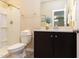 Modern bathroom with granite countertops, a walk-in shower, and a vanity for storage at 5908 Giddings St, Raleigh, NC 27616