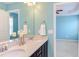 Bathroom featuring double sinks, quartz countertops, and modern fixtures at 5908 Giddings St, Raleigh, NC 27616