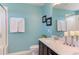 Stylish bathroom with sleek vanity, quartz counters, and decorative accents at 5908 Giddings St, Raleigh, NC 27616