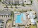 Aerial view of community pool surrounded by lounge chairs, clubhouse, and neighborhood homes at 5908 Giddings St, Raleigh, NC 27616