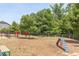 Spacious dog park with agility equipment and lush greenery, providing a fun and safe area for pets at 5908 Giddings St, Raleigh, NC 27616
