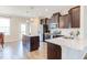 Bright kitchen featuring stainless steel appliances, granite countertops, and a functional layout at 5908 Giddings St, Raleigh, NC 27616
