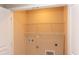 Utility room features hookups for laundry appliances and wire rack shelving at 5908 Giddings St, Raleigh, NC 27616
