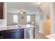 Open living area with connecting kitchen offering a view of the living space and staircase at 5908 Giddings St, Raleigh, NC 27616
