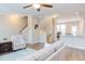 Open floorplan with hardwood floors flows from living area to kitchen with breakfast bar seating at 5908 Giddings St, Raleigh, NC 27616