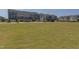 Community green space with grass and residences in the background at 5908 Giddings St, Raleigh, NC 27616