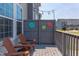 Charming outdoor patio with wood chairs and decorative outdoor lighting at 5908 Giddings St, Raleigh, NC 27616