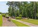 Neighborhood playground with walking trails and mature trees at 5908 Giddings St, Raleigh, NC 27616
