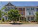 Charming townhomes boast colorful exteriors, manicured landscaping, and inviting front porches, creating an appealing street view at 5908 Giddings St, Raleigh, NC 27616