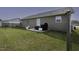Backyard featuring a patio, grill, and green grass area at 60 Falling Leaf Ln, Benson, NC 27504