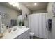 Well-lit bathroom featuring a vanity with framed mirror, decor, and a shower-tub combination at 60 Falling Leaf Ln, Benson, NC 27504
