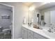 Bright bathroom featuring double vanity, framed mirror, and neutral color palette for a calming ambiance at 60 Falling Leaf Ln, Benson, NC 27504