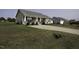 Inviting home with manicured lawn and driveway leading to ample parking spaces, showcasing curb appeal at 60 Falling Leaf Ln, Benson, NC 27504