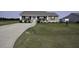 Well-maintained home boasting a spacious front yard and long driveway, perfect for Gathering and guests at 60 Falling Leaf Ln, Benson, NC 27504