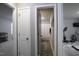 Hallway view of a half bathroom and home gym at 60 Falling Leaf Ln, Benson, NC 27504