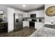 Well-equipped kitchen with stainless steel appliances, granite countertops, and ample cabinet space at 60 Falling Leaf Ln, Benson, NC 27504