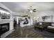 Open-concept living area with fireplace, modern decor, and seamless flow into the adjacent kitchen at 60 Falling Leaf Ln, Benson, NC 27504
