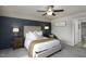 Serene main bedroom featuring panel accent wall, neutral decor, and an ensuite bathroom at 60 Falling Leaf Ln, Benson, NC 27504