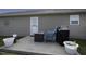 Patio space with table, chairs, grill, and potted plants at 60 Falling Leaf Ln, Benson, NC 27504