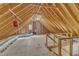 Unfinished attic space with exposed beams and a brick chimney at 6201 Bayswater Trail Trl, Raleigh, NC 27612