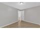 Bright bedroom leads to another room and features light walls and laminated flooring at 6201 Bayswater Trail Trl, Raleigh, NC 27612