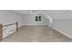 Spacious bonus room with vaulted ceilings, wood floors, and a ceiling fan at 6201 Bayswater Trail Trl, Raleigh, NC 27612