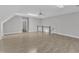 Spacious bonus room featuring a ceiling fan, neutral walls, and wood floors at 6201 Bayswater Trail Trl, Raleigh, NC 27612