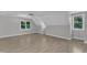 Large bonus room featuring vaulted ceilings, neutral walls, and multiple windows at 6201 Bayswater Trail Trl, Raleigh, NC 27612