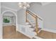 Traditional entryway featuring a staircase, hardwood floors, and decorative moldings at 6201 Bayswater Trail Trl, Raleigh, NC 27612