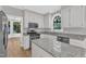 Stylish kitchen with stainless steel appliances, granite counters, and ample cabinet space at 6201 Bayswater Trail Trl, Raleigh, NC 27612