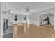 Sunlit living room featuring hardwood floors, recessed lighting, and white trim at 6201 Bayswater Trail Trl, Raleigh, NC 27612