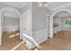 A bright, open living space with hardwood floors, white trim, and archways at 6201 Bayswater Trail Trl, Raleigh, NC 27612