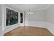 Bright and airy dining area with large bay window, hardwood floors, and elegant trim at 6201 Bayswater Trail Trl, Raleigh, NC 27612