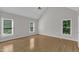 Bright bedroom with vaulted ceilings, hardwood floors, and large windows at 6201 Bayswater Trail Trl, Raleigh, NC 27612