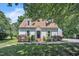 Charming home featuring dormer windows, a peaked roof, and a welcoming purple front door at 6328 Jones Farm Rd, Wake Forest, NC 27587
