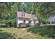 Charming home with a well-maintained lawn, dormer windows, and a welcoming front entrance at 6328 Jones Farm Rd, Wake Forest, NC 27587