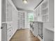 Bright laundry room with built-in shelving and washer/dryer at 6328 Jones Farm Rd, Wake Forest, NC 27587