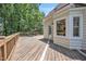 Open wooden deck area connected to the home, offering a view of the surrounding greenery at 6328 Jones Farm Rd, Wake Forest, NC 27587
