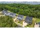 Residential homes with backyard and tree-lined perimeter, surrounded by lush greenery at 74 Permit Ct, Chapel Hill, NC 27517