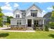 Charming two-story home with a welcoming front porch and beautifully landscaped front yard at 74 Permit Ct, Chapel Hill, NC 27517